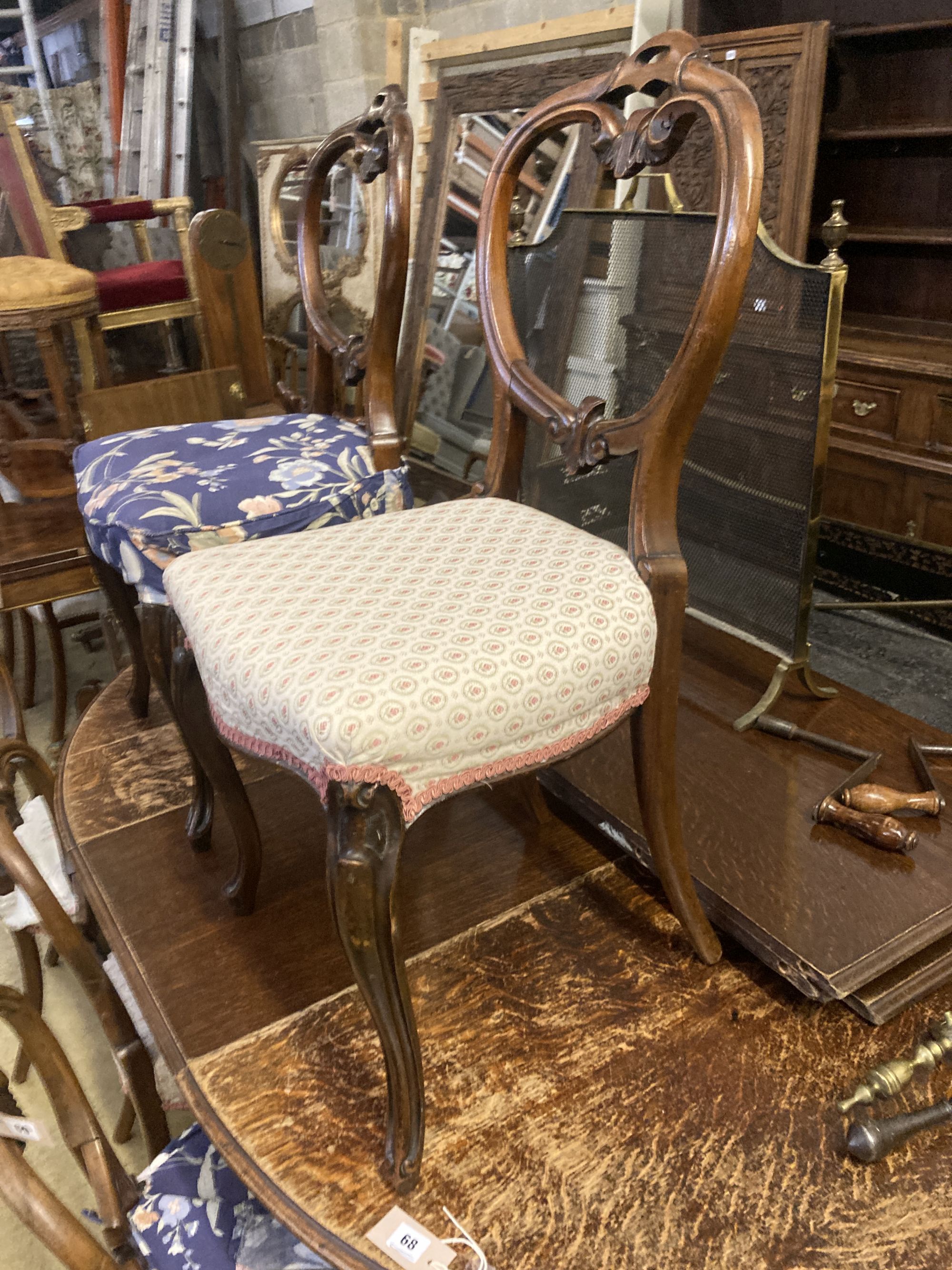 A set of six Victorian balloon back rosewood dining chairs